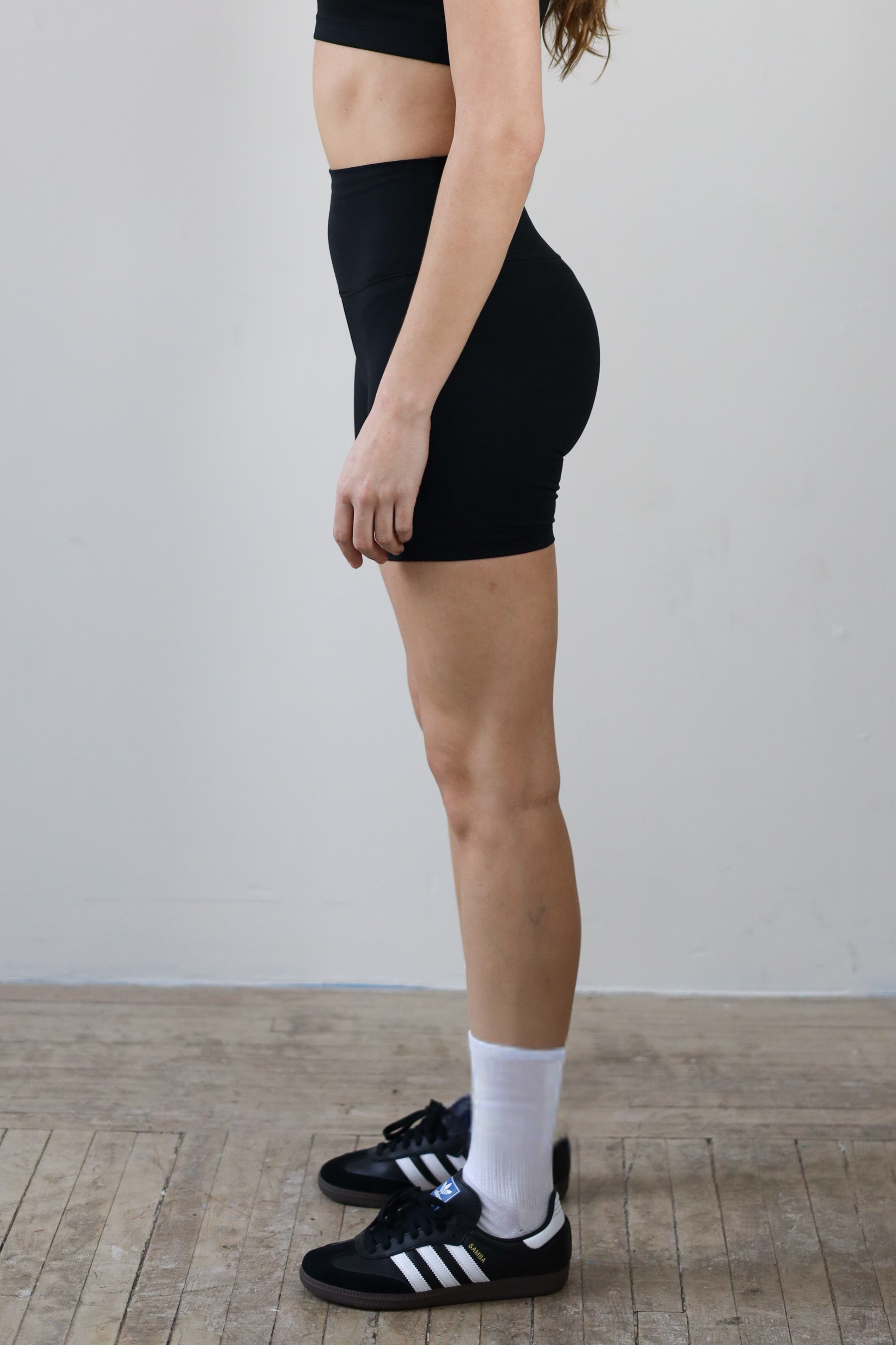 Premium black high-waisted bike shorts for wholesale – buttery-soft, squat-proof, and moisture-wicking. Perfect for brands to customize and private label. Designed for ultimate comfort and performance in athleisure and activewear collections.