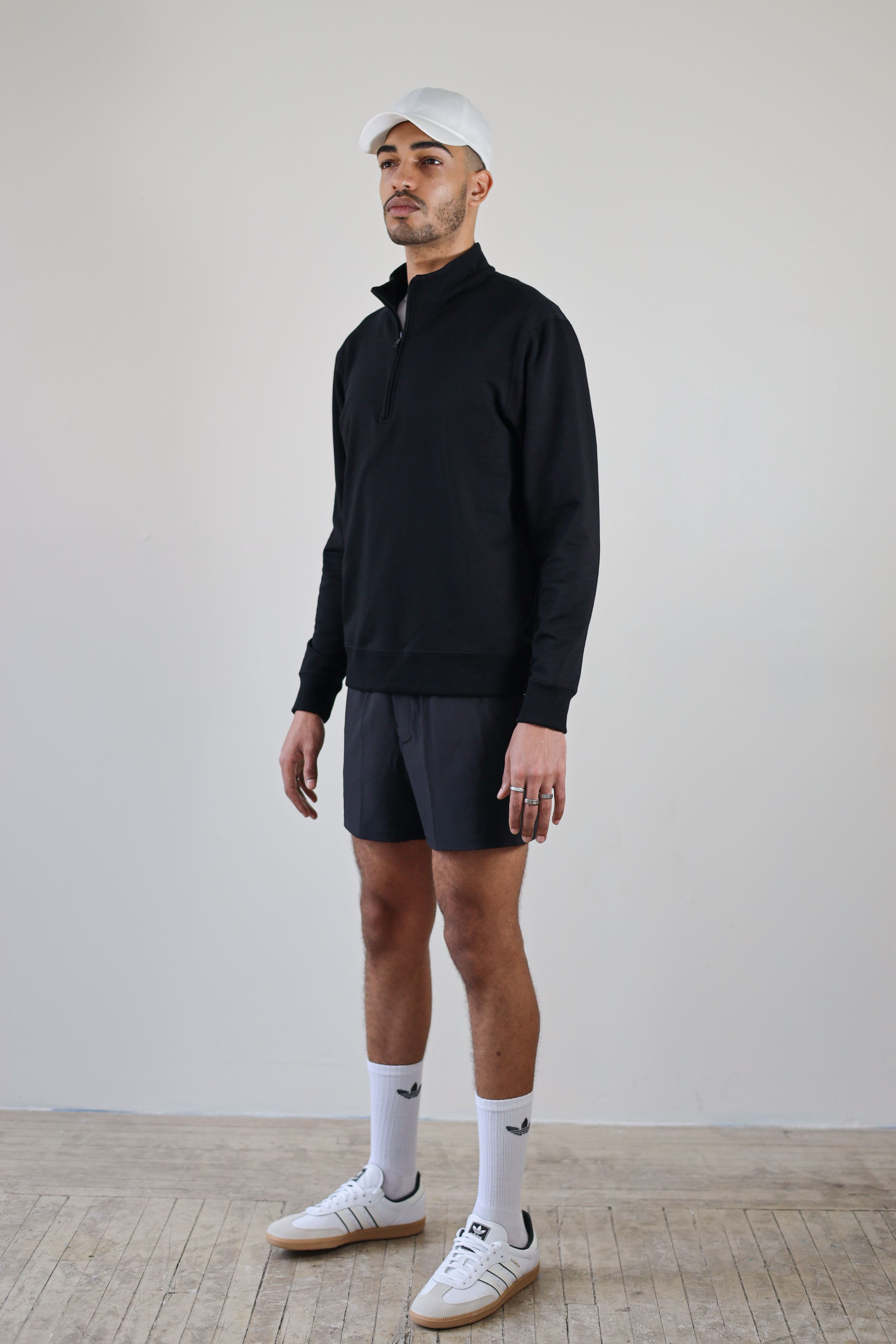 Men’s 1/4 Zip Crewneck in Black – full body model view styled for streetwear and activewear versatility