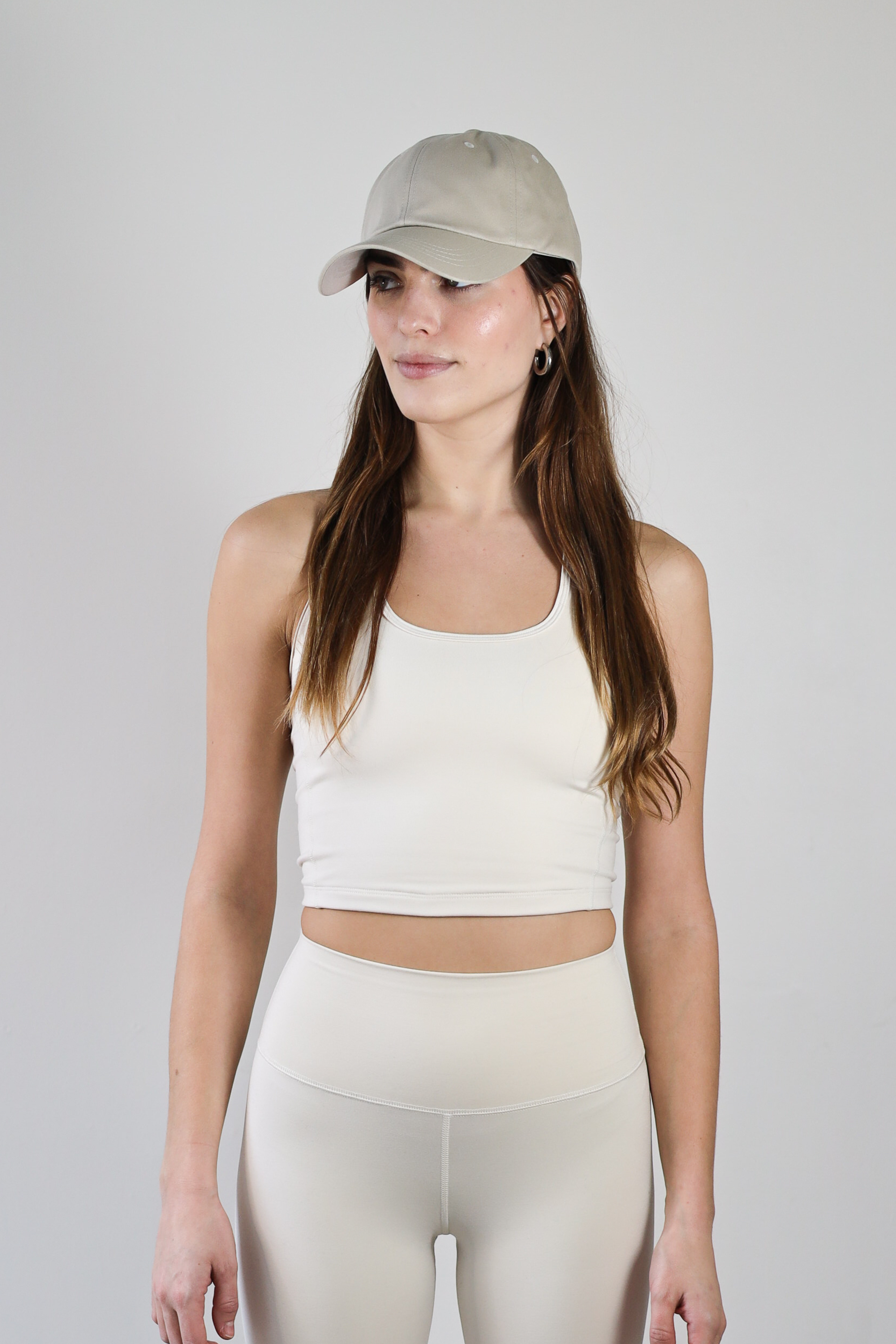 Premium wholesale ecru crop top for brands – buttery-soft, breathable, and moisture-wicking. Designed for private labeling, custom branding, and activewear collections. Sustainable, high-stretch fabric ideal for athleisure, workouts, and casual wear.
