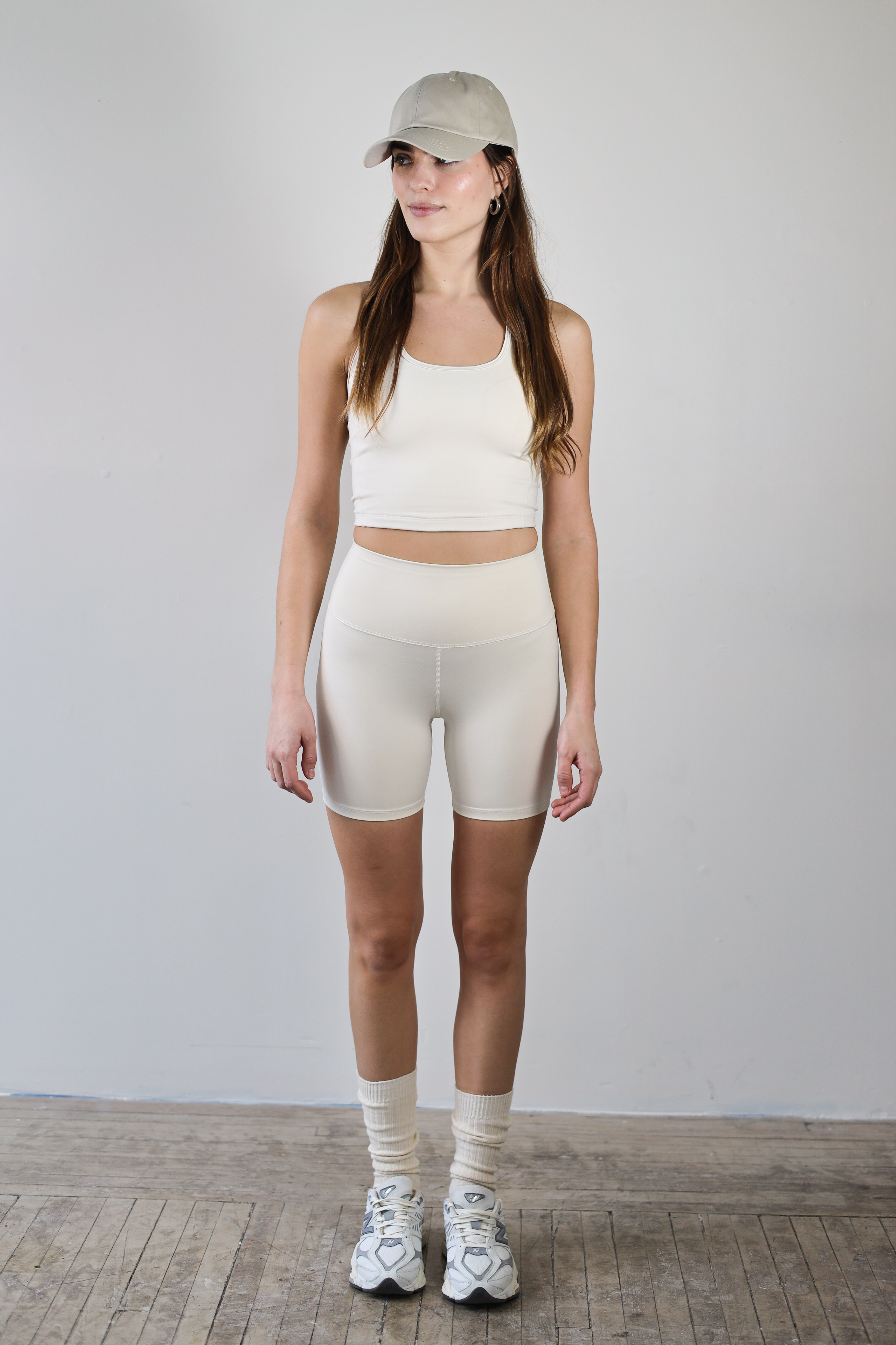 Premium wholesale ecru crop top for brands – buttery-soft, breathable, and moisture-wicking. Designed for private labeling, custom branding, and activewear collections. Sustainable, high-stretch fabric ideal for athleisure, workouts, and casual wear.