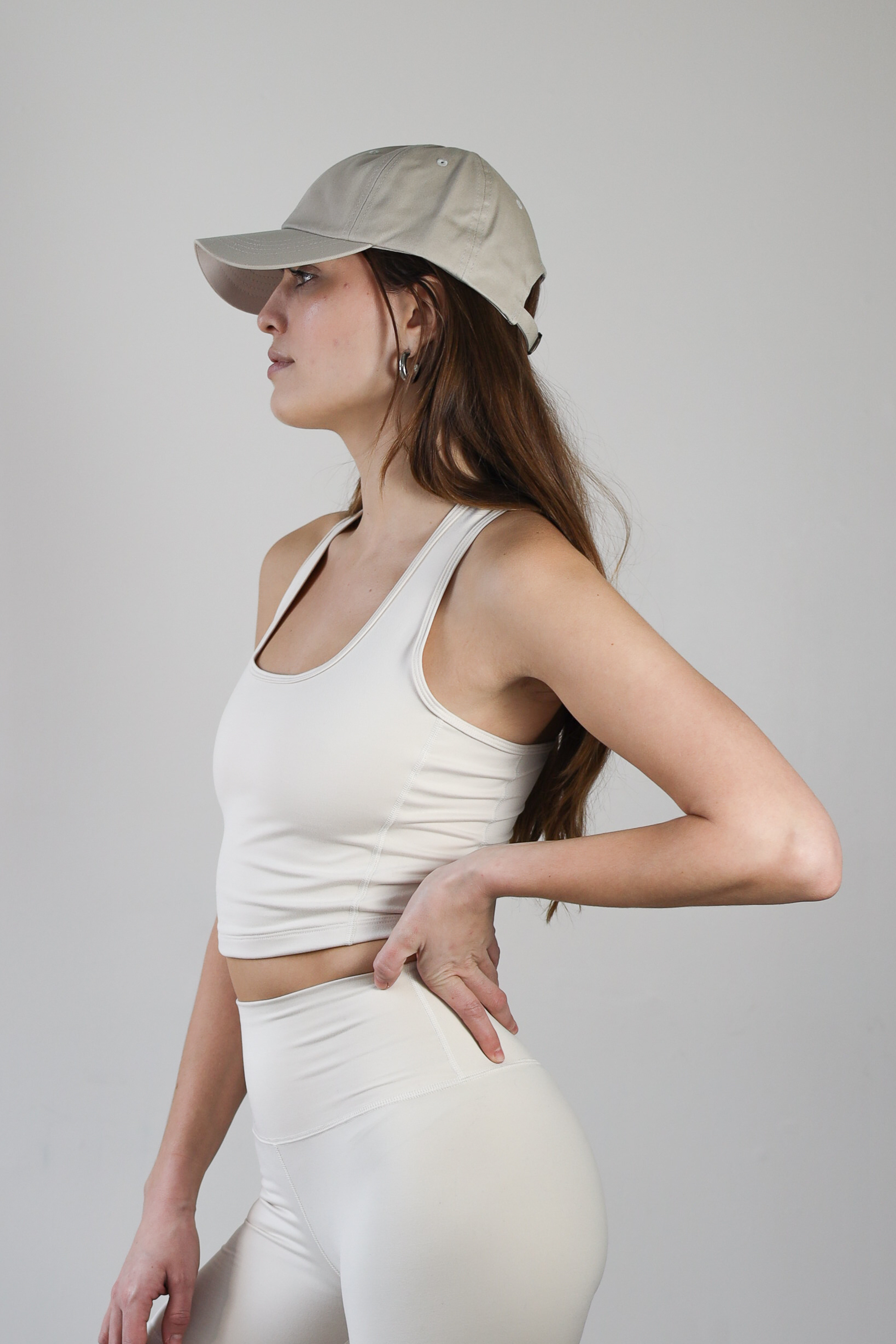 Premium wholesale ecru crop top for brands – buttery-soft, breathable, and moisture-wicking. Designed for private labeling, custom branding, and activewear collections. Sustainable, high-stretch fabric ideal for athleisure, workouts, and casual wear.