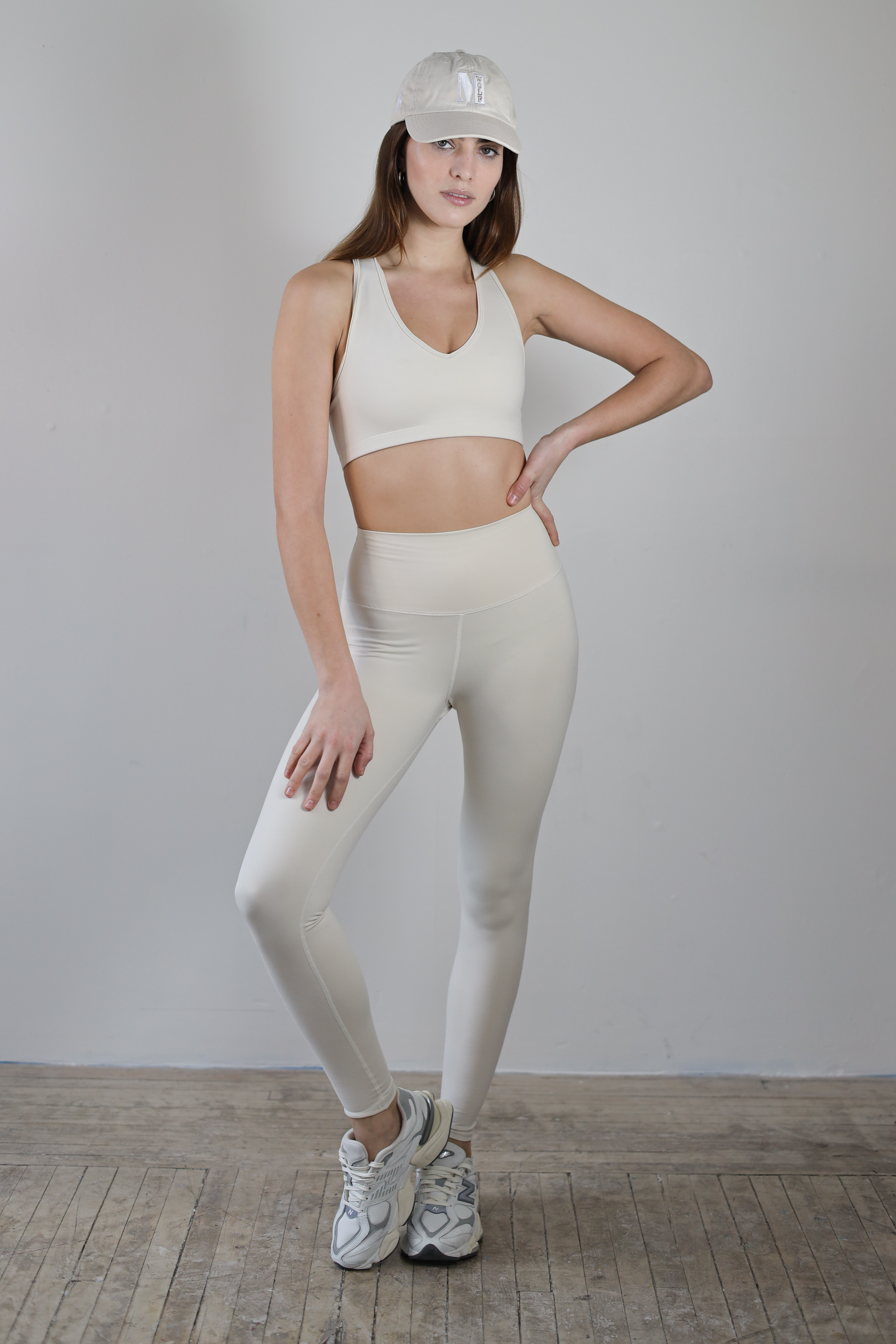Premium ecru high-waisted leggings for wholesale – buttery-soft, squat-proof, and moisture-wicking. Designed for brands to customize and private label. Ideal for athleisure and activewear collections with a sleek, performance-driven fit.